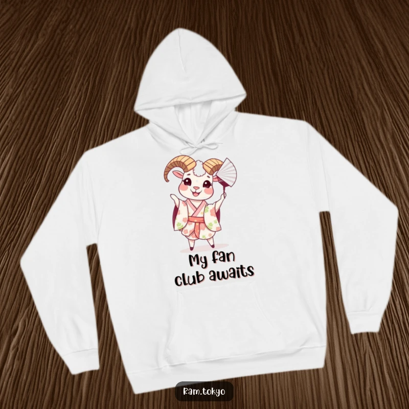 Funny hoodie with a cheerful ram in a floral kimono, captured in the act of playfully tossing a decorative paper fan.
